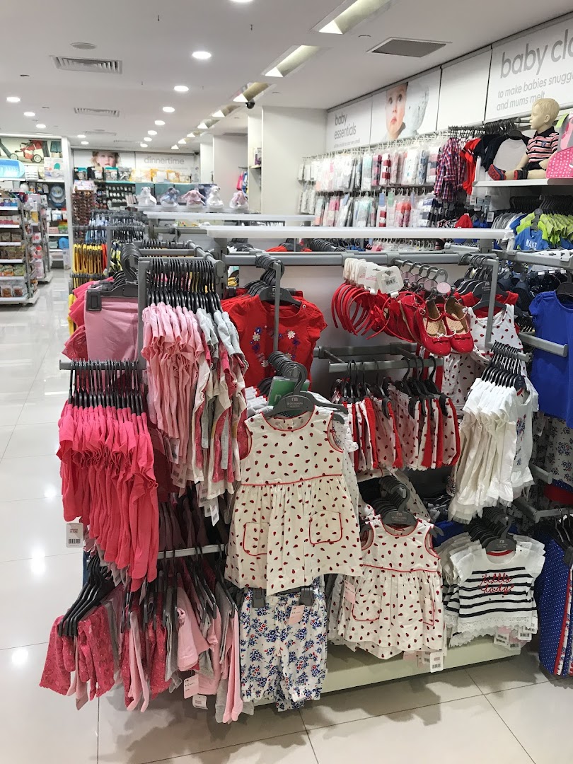 An interior view of Mothercare, showcasing a wide array of baby and children's clothing and essentials.