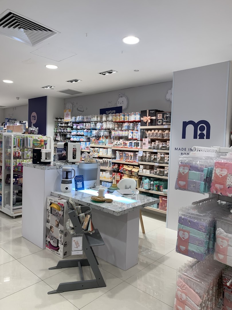 Interior view of Mothercare, showcasing baby products, feeding essentials, and a high chair display.