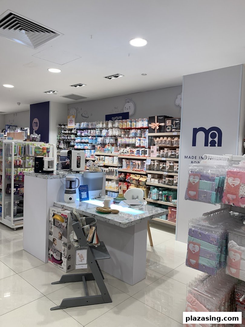 Interior view of Mothercare, showcasing baby products, feeding essentials, and a high chair display.
