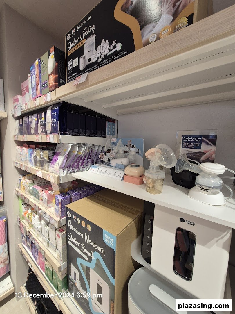 Shelves stocked with baby feeding and sterilizing products, including breast pumps and bundles, at Mothercare.