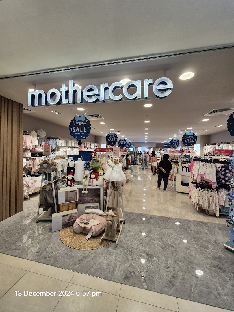 The entrance of Mothercare, showcasing baby and children's clothing, accessories, and nursery items during a 'biggest sale'.