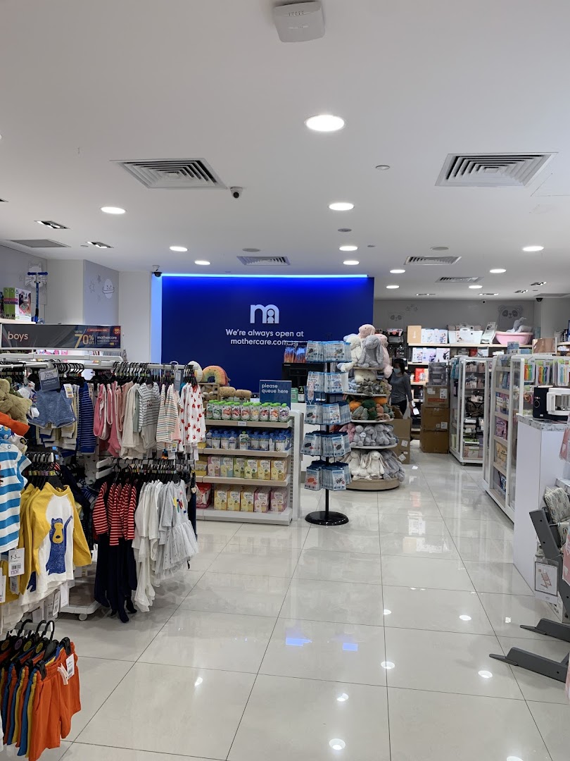Brightly lit interior of Mothercare, showcasing baby clothes, feeding essentials, and various children's products.