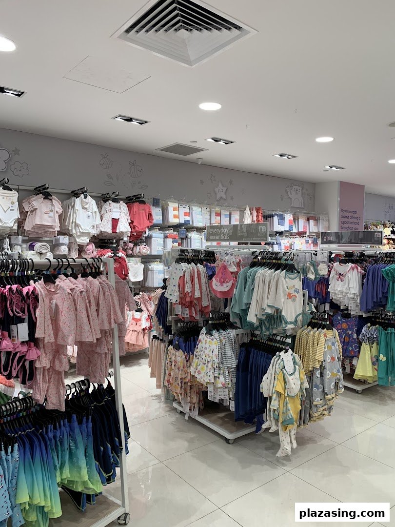 An interior view of Mothercare, showcasing a wide array of baby and children's clothing and essentials.