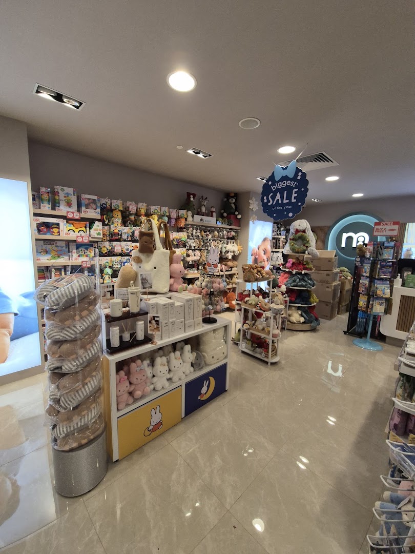 Interior view of Mothercare, showcasing a wide range of baby products, toys, and plushies, with a "biggest SALE" sign.