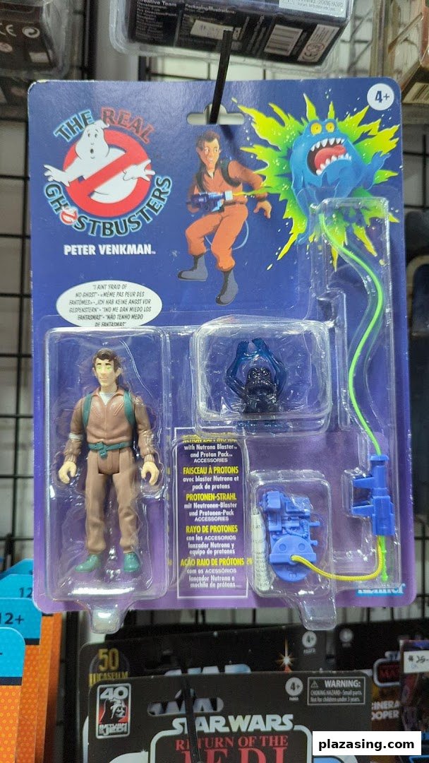A packaged 'The Real Ghostbusters' Peter Venkman action figure displayed in a retail shop.