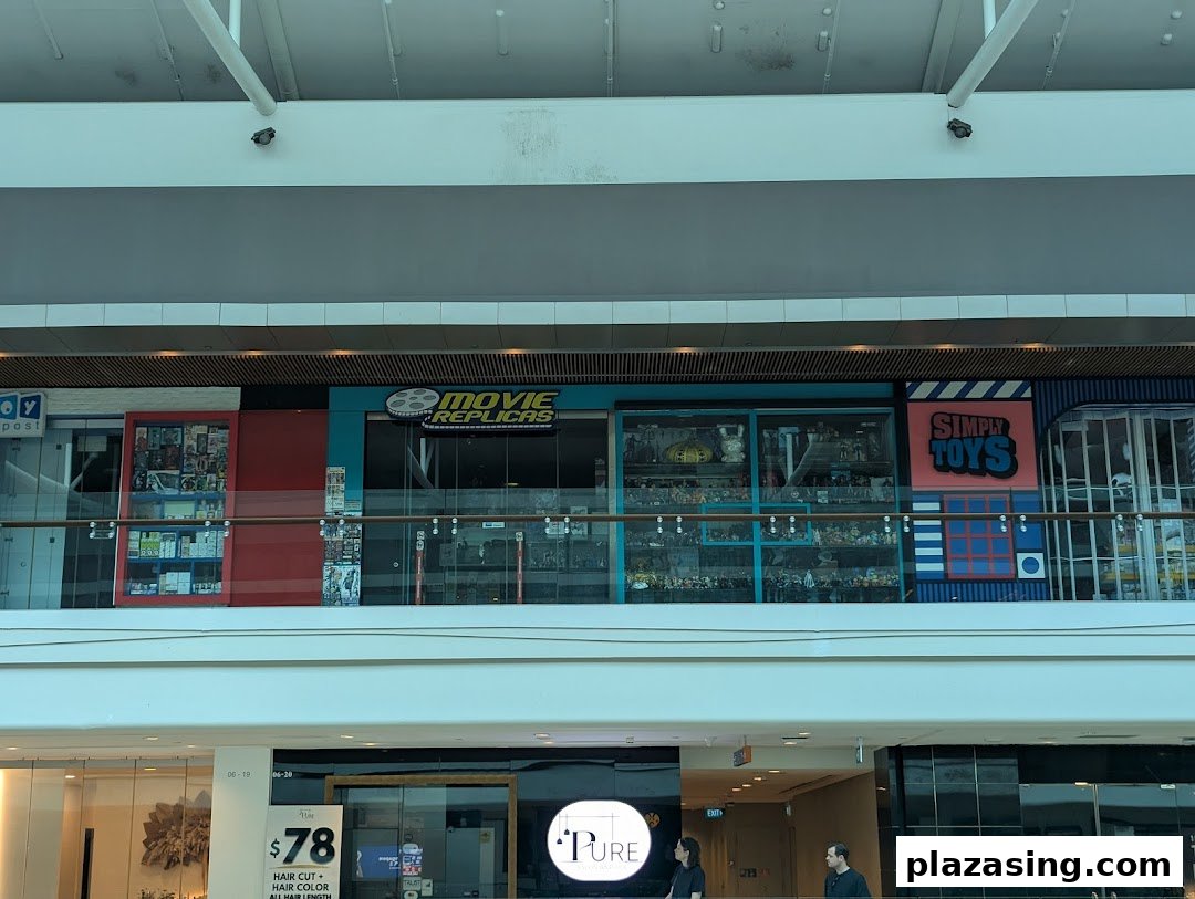 The shop front of Movie Replicas Collection and Simply Toys, viewed from across a mall level.