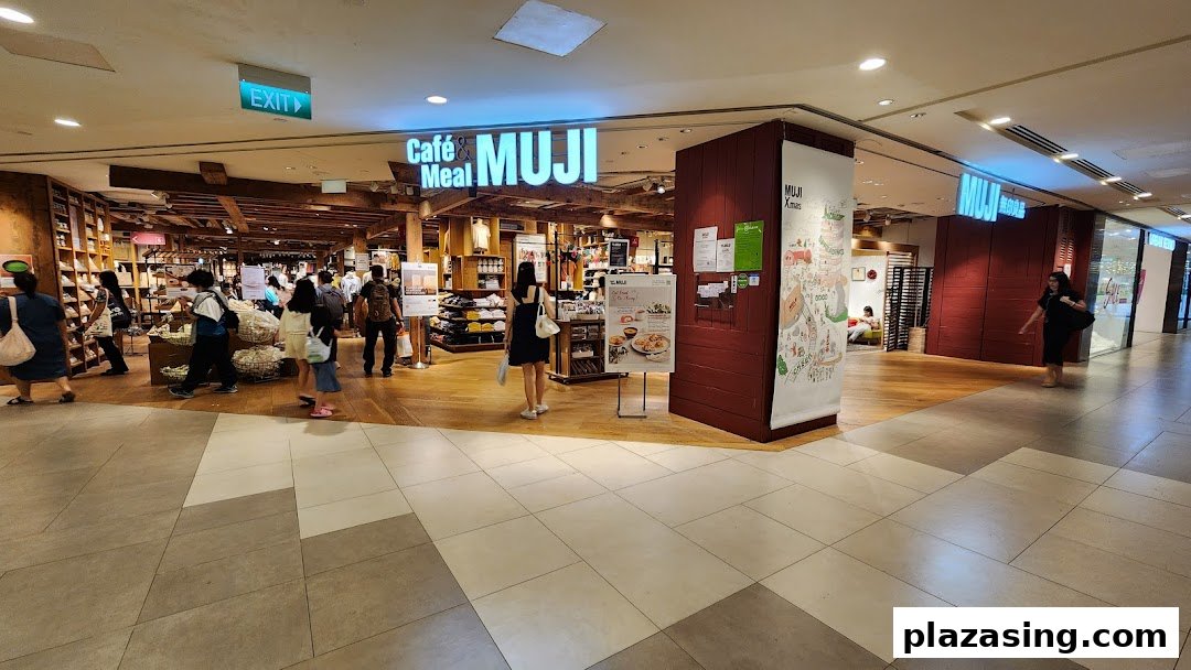 The entrance of MUJI Plaza Singapura, showcasing its lifestyle products and 'Cafe & Meal MUJI' section.