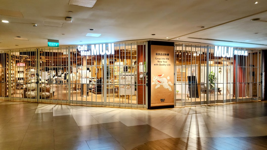 The closed storefront of MUJI Plaza Singapura, featuring its logo and a New Year promotional banner.
