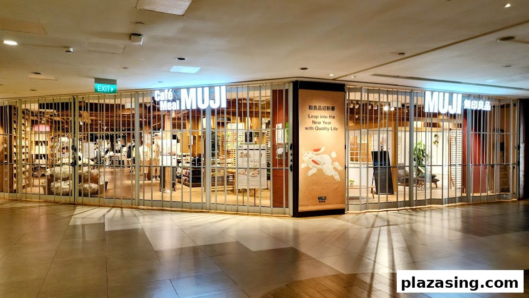 The closed storefront of MUJI Plaza Singapura, featuring its logo and a New Year promotional banner.