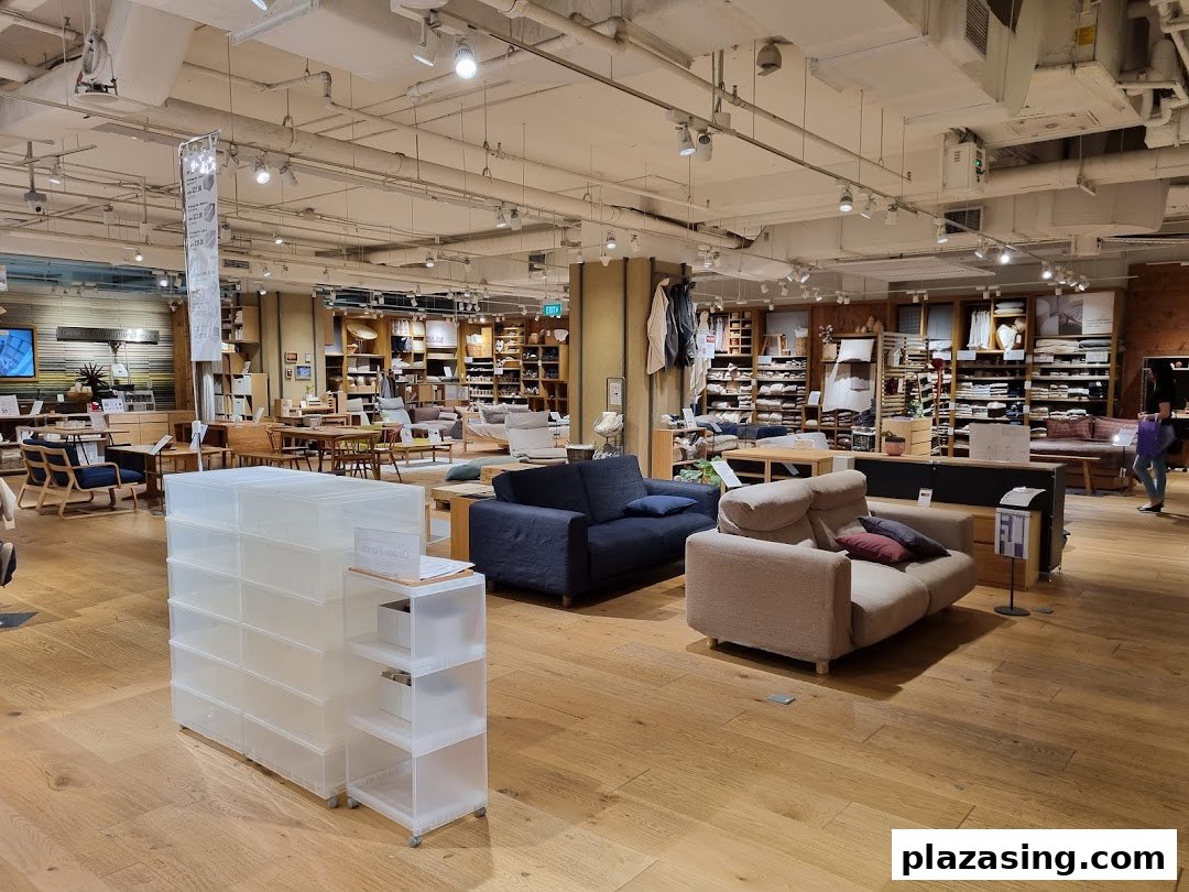 Interior view of MUJI store showcasing furniture, home goods, and storage solutions in a spacious layout.