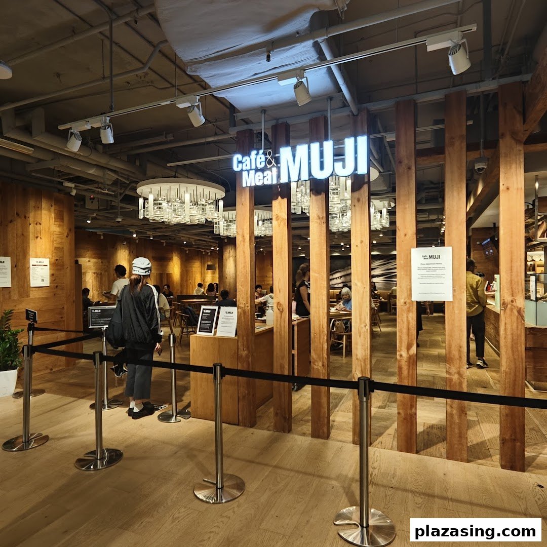 Entrance to Cafe & Meal MUJI, featuring a warm wooden interior and dining area.