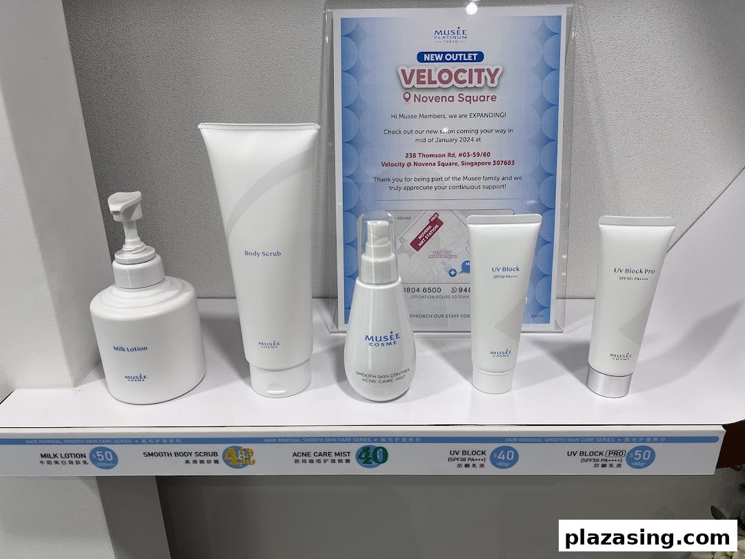A display of Musee Platinum Tokyo skincare products and a promotional poster for their new Velocity outlet.