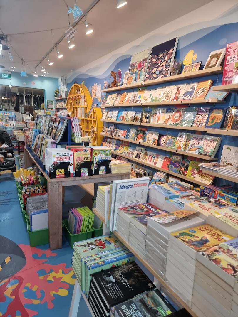 Vibrant interior of a children's bookstore, showcasing shelves filled with diverse books and a playful atmosphere.