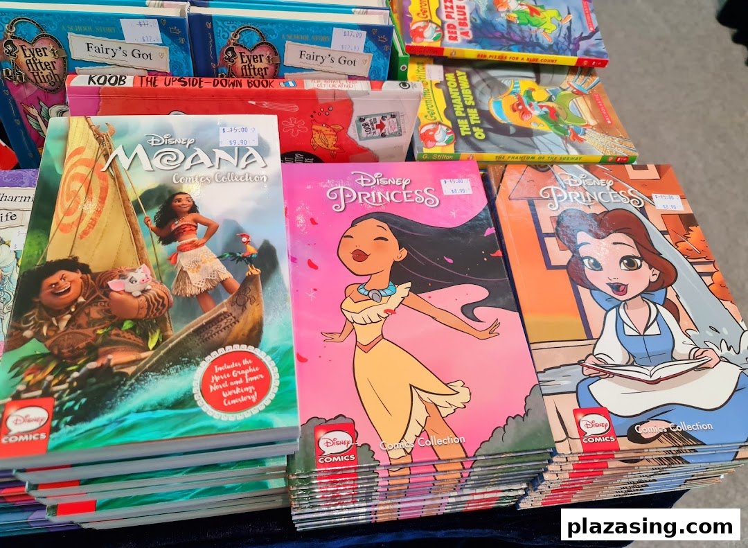 Close-up of Disney and children's comic books and novels on display.