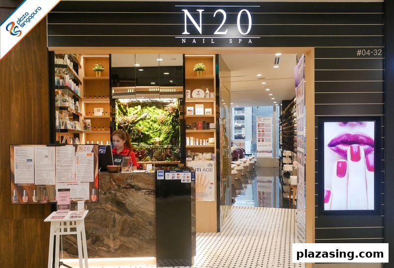 The inviting entrance of N20 Nail Spa, featuring a reception desk, lush green decor, and a glimpse of the interior.