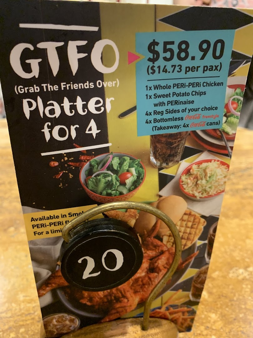 A Nando's menu board showcasing the 'GTFO Platter for 4' deal with price and inclusions.