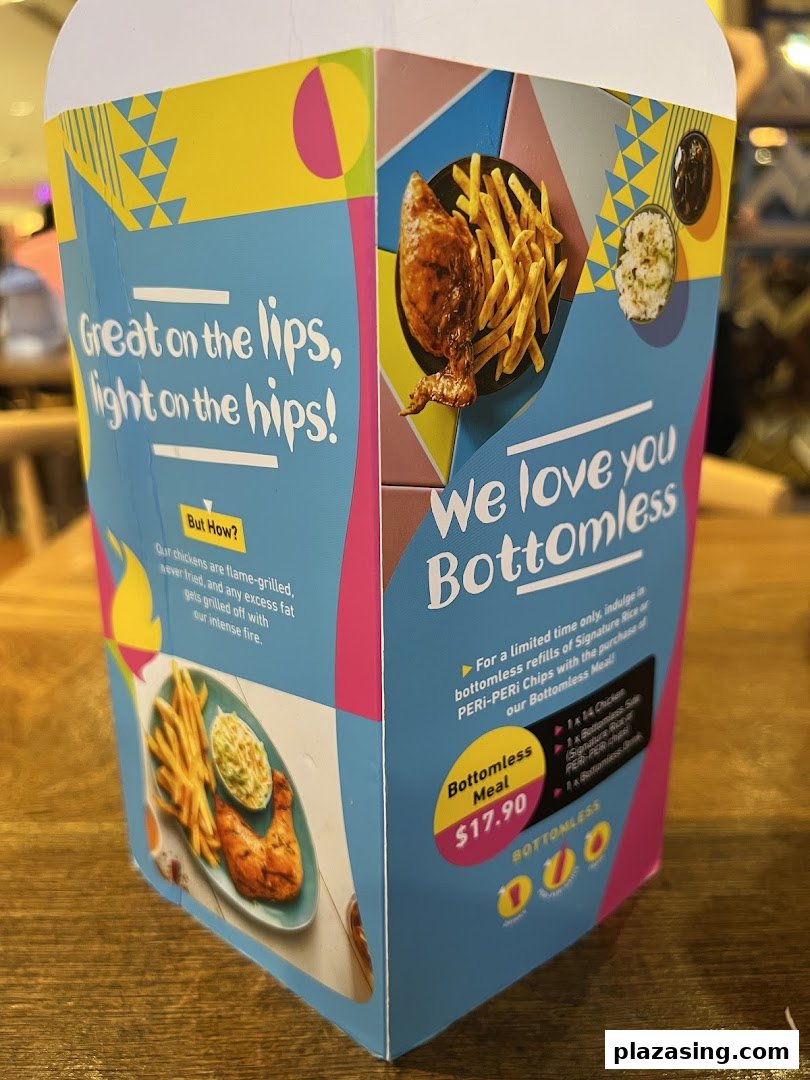 A promotional display for Nando's Bottomless Meal featuring flame-grilled chicken and sides.