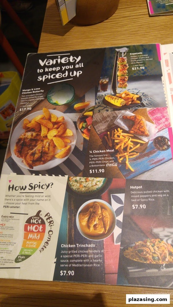 A Nando's menu displaying various flame-grilled PERi-PERi chicken dishes and spice levels.
