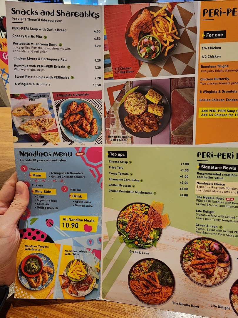A comprehensive Nando's menu displaying flame-grilled chicken, snacks, and kids' meals.