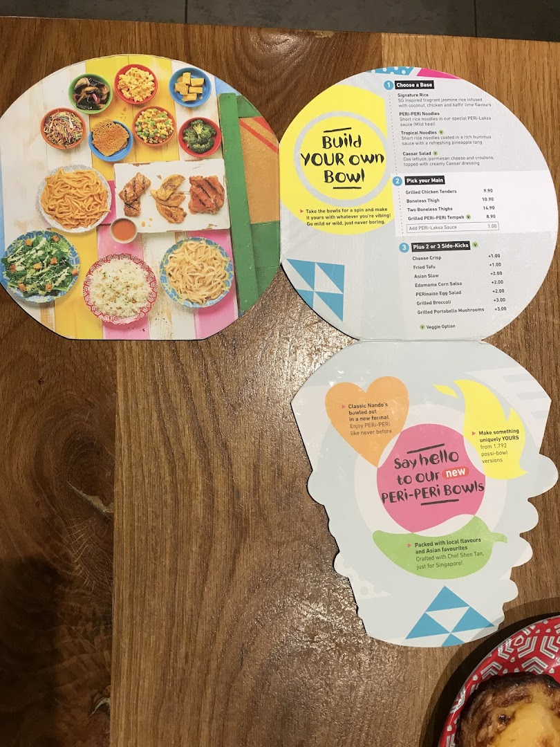 A vibrant Nando's menu showcasing their new 'Build Your Own PERi-PERi Bowl' concept.