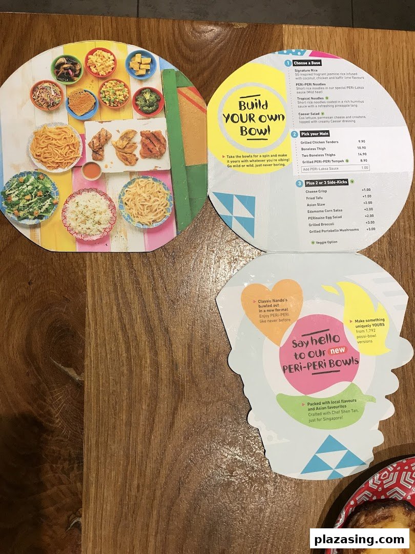 A vibrant Nando's menu showcasing their new 'Build Your Own PERi-PERi Bowl' concept.