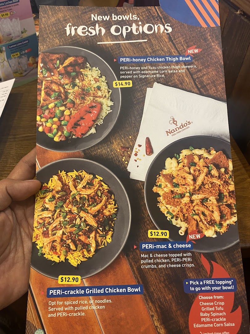 A Nando's menu page showcasing new PERi-PERi chicken bowls and fresh options with prices.