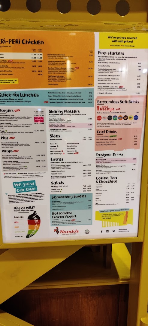 A detailed menu board for Nando's, showcasing their PERi-PERi chicken, sides, drinks, and desserts.