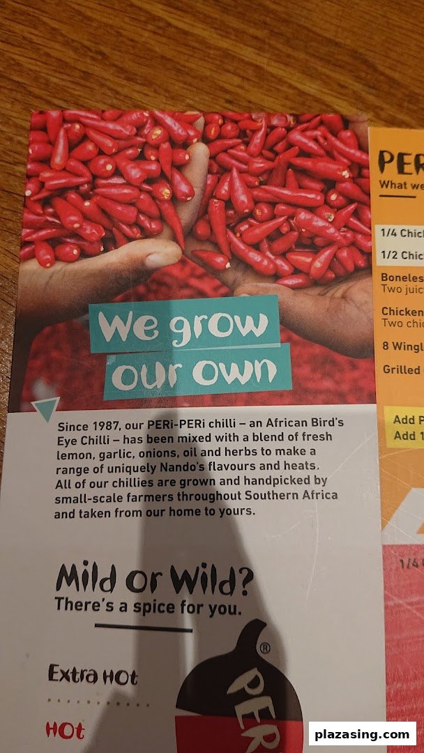 A Nando's menu page highlighting their PERi-PERi chilli sourcing and heat levels, with partial menu items.
