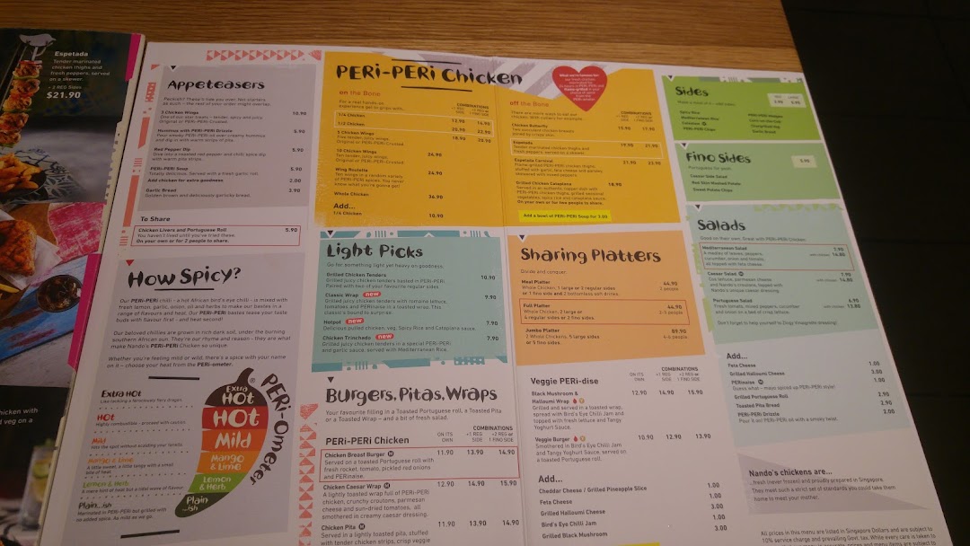 A detailed view of Nando's menu featuring PERi-PERi chicken, sides, and platters.