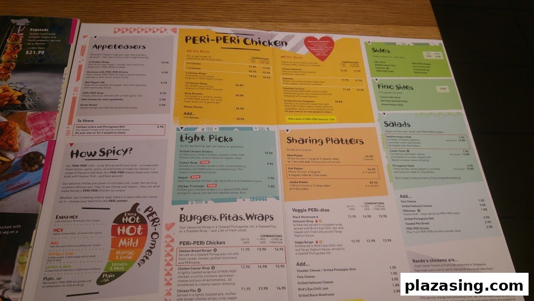 A detailed view of Nando's menu featuring PERi-PERi chicken, sides, and platters.