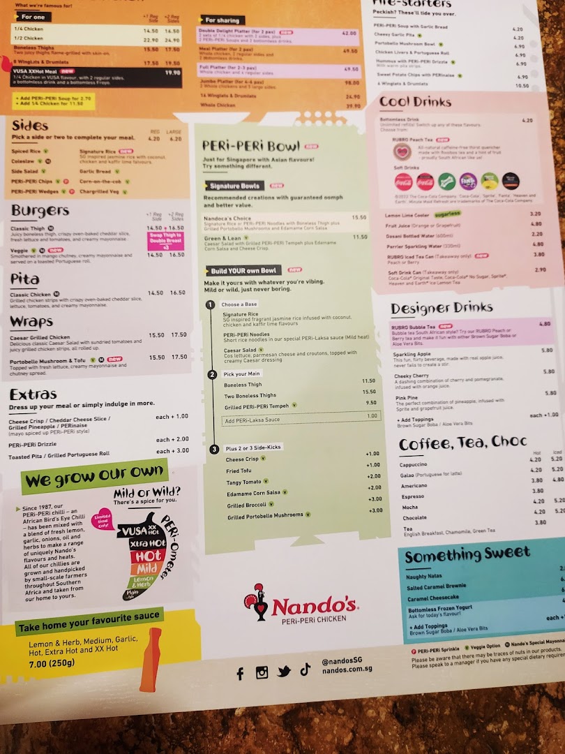 A detailed menu from Nando's featuring a wide range of PERi-PERi chicken dishes, sides, and drinks.