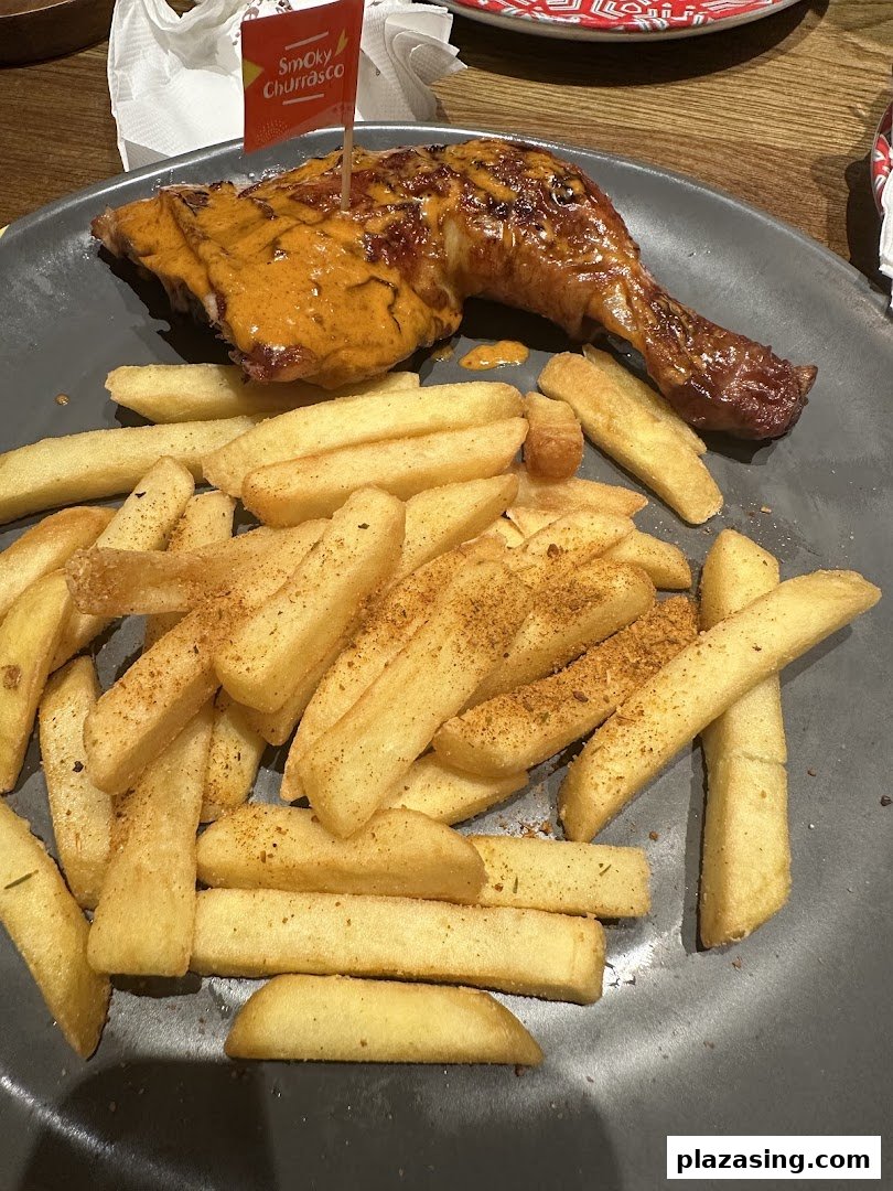 Flame-grilled chicken with Smoky Churrasco sauce and seasoned PERi-PERi fries.