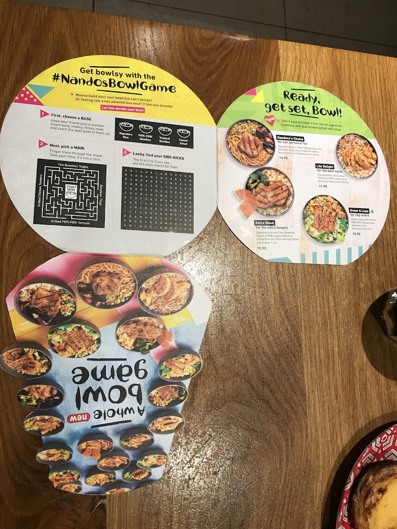 A Nando's promotional menu featuring customizable PERi-PERi bowls and a fun 'Bowl Game'.