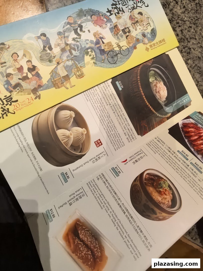 An open menu from Nanjing Impressions, showcasing various authentic Chinese dishes and prices.