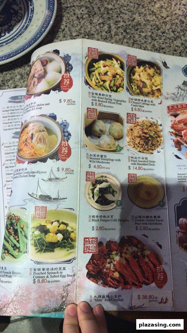 A detailed menu page from Nanjing Impressions, showcasing various Chinese dishes with prices and images.