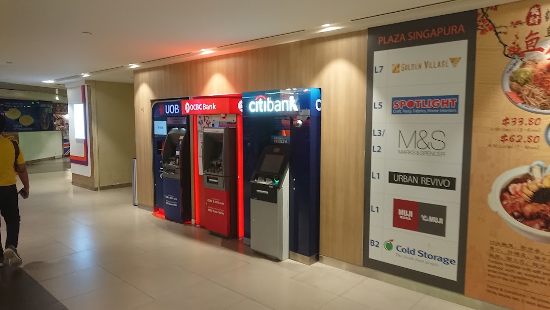 A row of ATMs from UOB, OCBC, and Citibank, alongside a mall directory at Plaza Singapura.