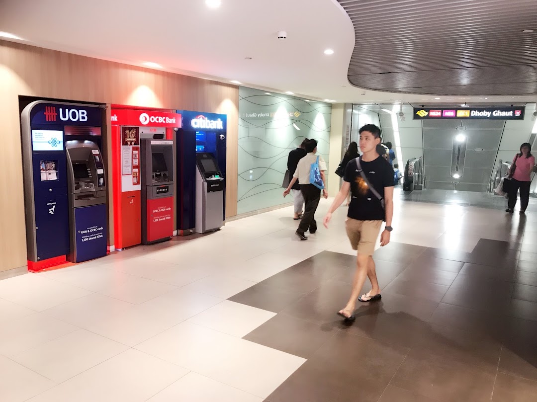 A row of ATMs from UOB, OCBC, and Citibank providing convenient banking services in a mall corridor.