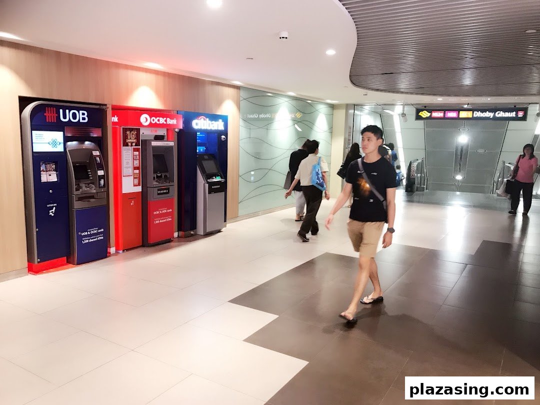 A row of ATMs from UOB, OCBC, and Citibank providing convenient banking services in a mall corridor.