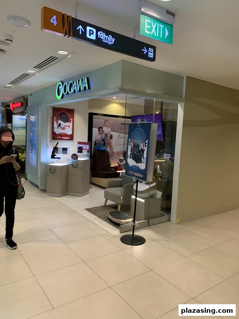 The OGAWA shop entrance in a mall, showcasing wellness products and massage chairs through its glass facade.