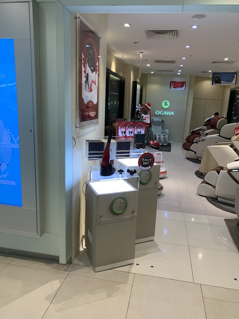 Interior view of OGAWA store showcasing various massage chairs and wellness products.