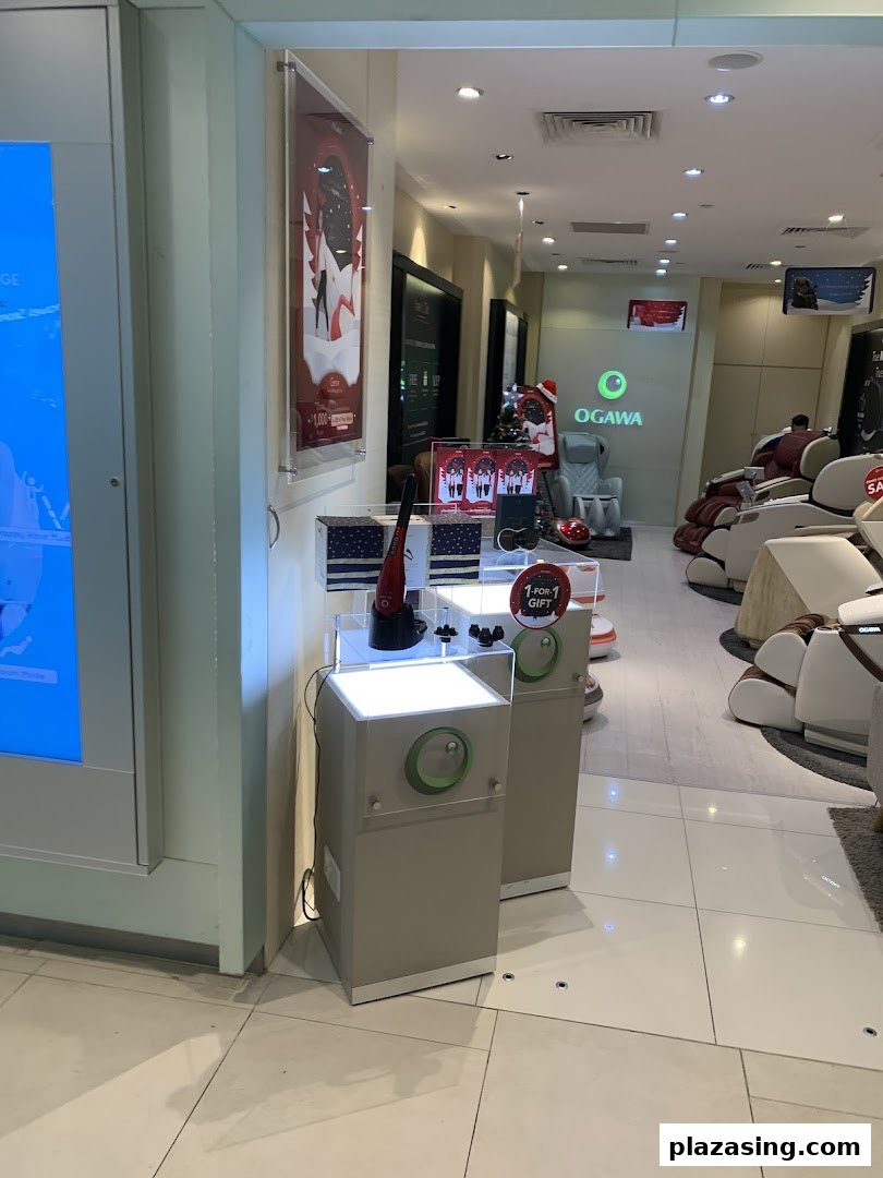Interior view of OGAWA store showcasing various massage chairs and wellness products.
