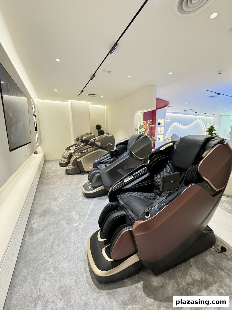 Interior view of OGAWA shop showcasing several luxury massage chairs in a modern setting.