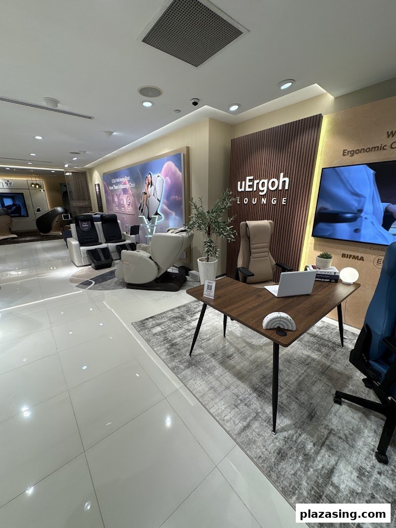 Interior view of OSIM Plaza Singapura showcasing various massage chairs and ergonomic furniture in a modern showroom.