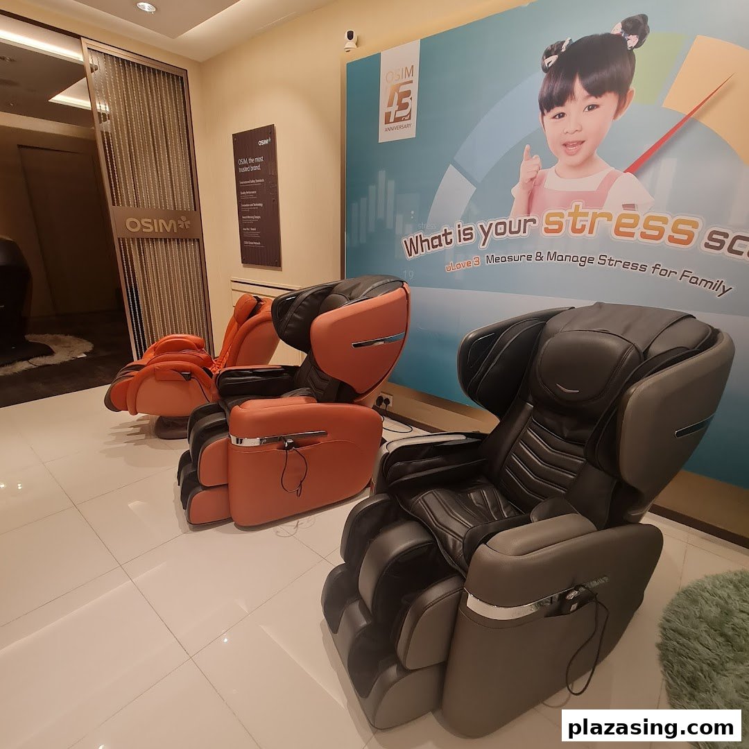 Interior view of OSIM showroom featuring various massage chairs and a large promotional banner.