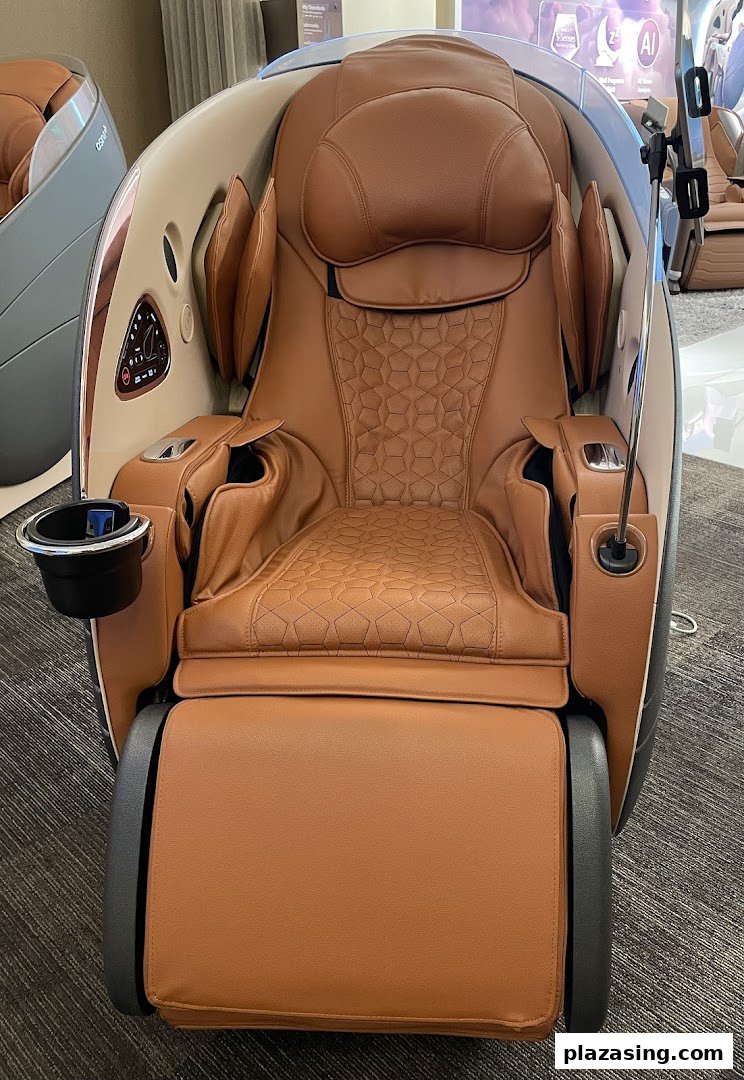 A luxurious brown OSIM massage chair with intricate detailing and a cup holder.