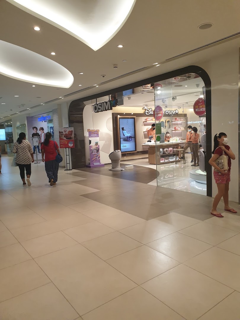 The storefront of OSIM, a wellness and massage product shop, in a bustling shopping mall.