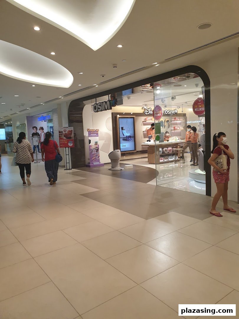The storefront of OSIM, a wellness and massage product shop, in a bustling shopping mall.