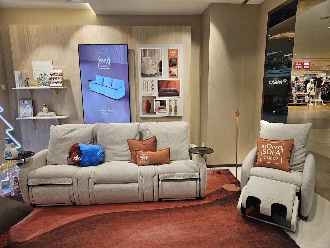An OSIM display featuring the uDiva SOFA, a modular massage sofa, and a matching massage chair in a mall setting.