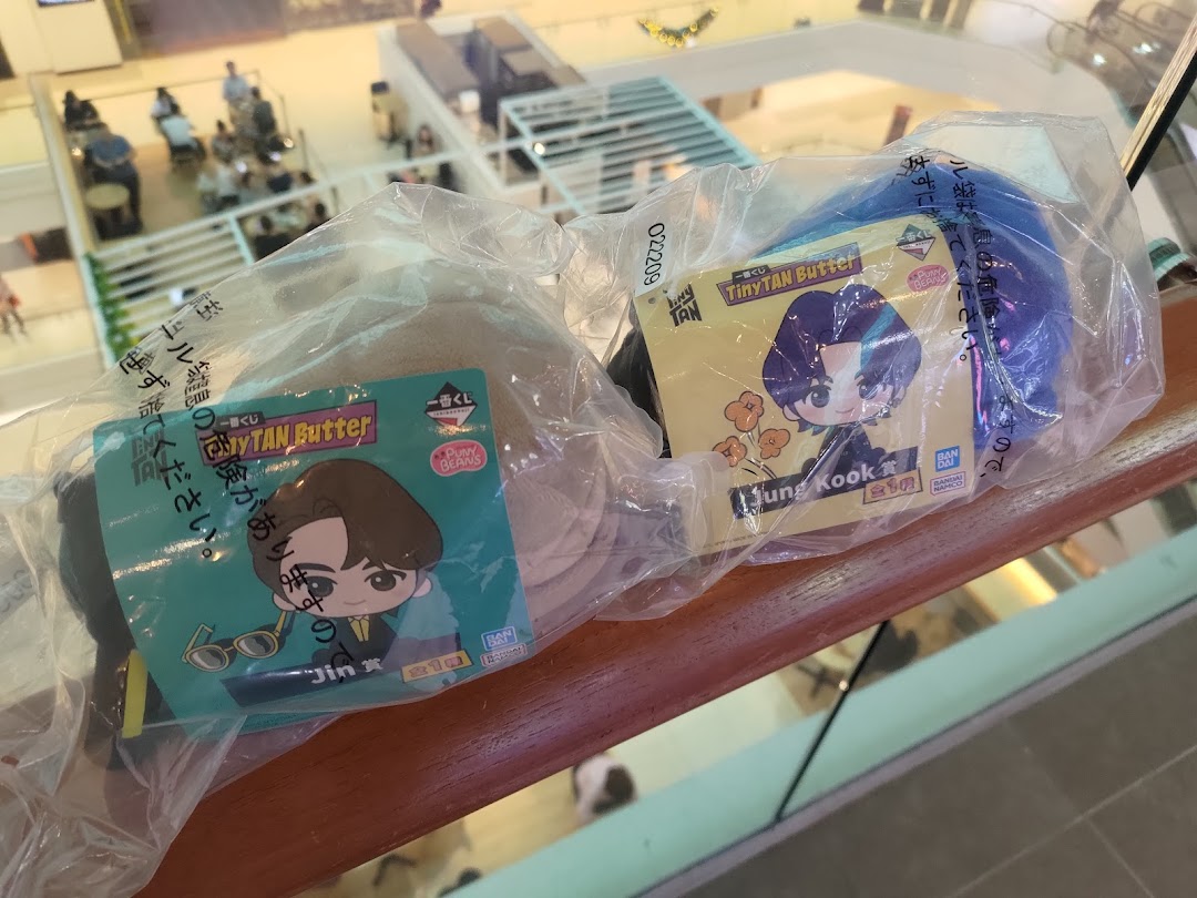Two packaged TinyTAN Butter merchandise featuring Jin and Jung Kook are displayed.