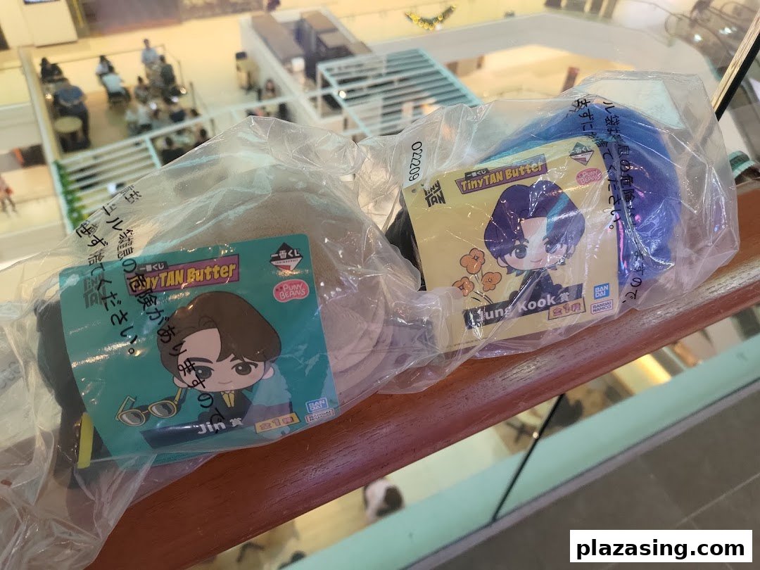Two packaged TinyTAN Butter merchandise featuring Jin and Jung Kook are displayed.